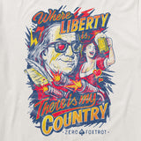 Close-up of a vintage-style graphic on a My Country Tee featuring a patriotic slogan with an illustrated figure wearing heart-shaped sunglasses, a woman raising a beer mug, and bold red, yellow, and blue colors.