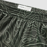 Close-up view of olive green Topographic Silkies featuring a detailed topographic contour line pattern and an elastic waistband with a branded inner label.