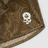 Close-up of brown fabric with beige topographic map pattern and a white skull logo featuring a spade symbol, part of the Topographic Silkies design.