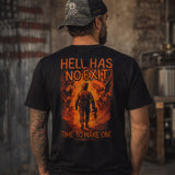 Man wearing a black No Exit Tee with a vivid fiery graphic on the back showing a soldier walking into flames with the text "Hell Has No Exit" and "Time to Make One" in bold orange letters.