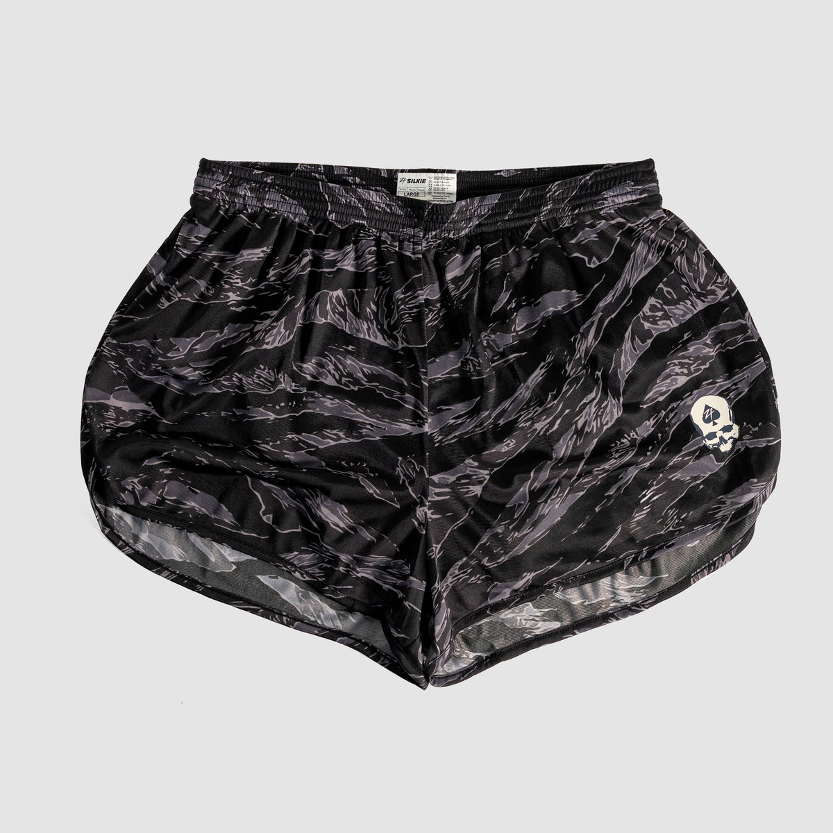 Black and gray camouflage patterned lightweight shorts with an elastic waistband and a small skull logo on the front, designed for comfort and movement, labeled ZF Silkies - Camos.