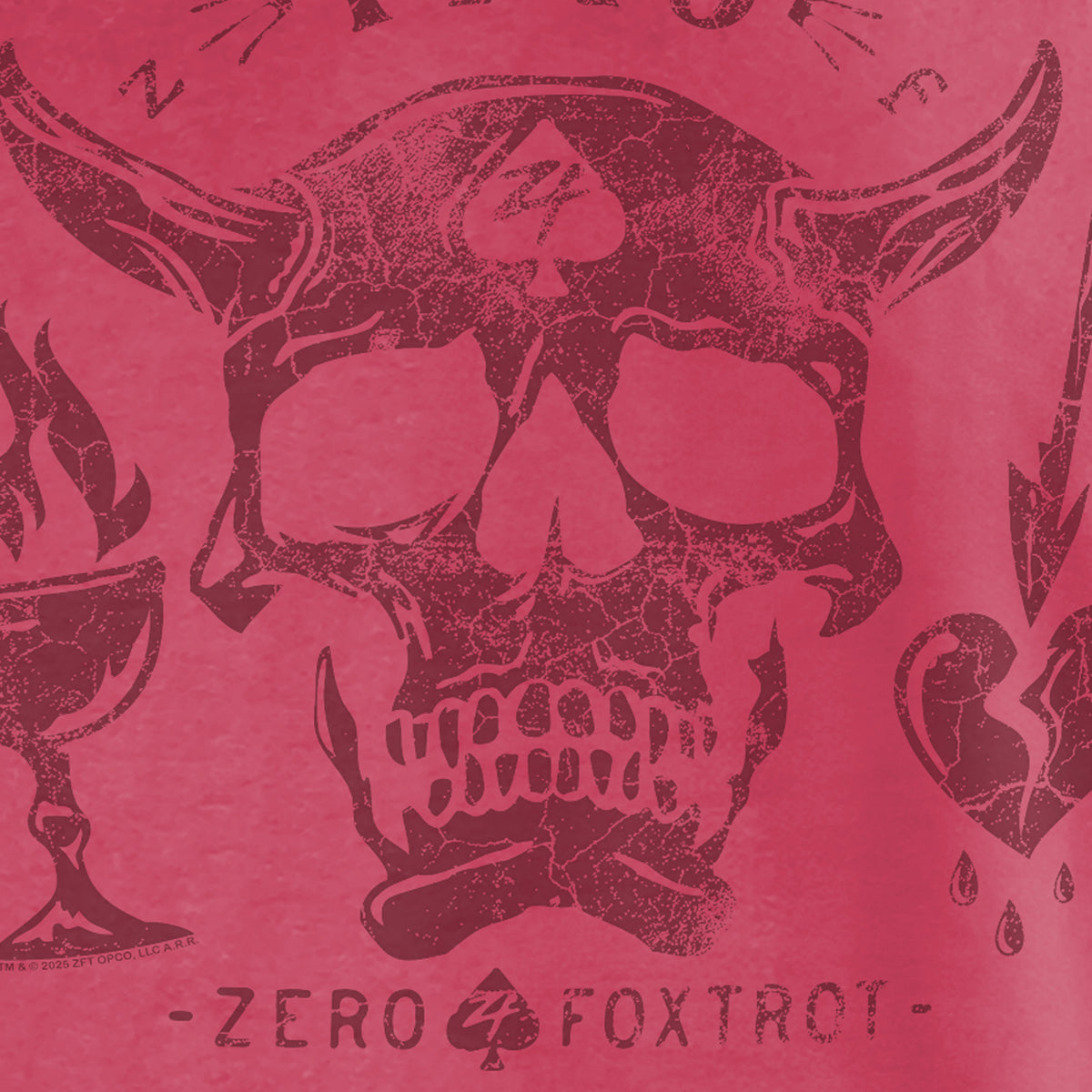Close-up view of a distressed skull with horns and a spade symbol on the forehead, surrounded by stylized flames and hearts, printed on a red fabric of the Blackbeard 1718 Tee.
