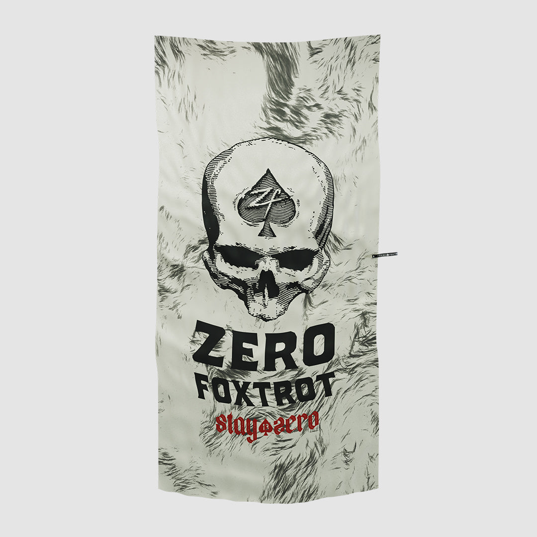 Microfiber Beach Towels featuring a white and gray design with a large skull graphic topped by a spade symbol and bold text reading "Zero Foxtrot" and "stay aero" in red.