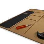 ZF Gun Cleaning Mat in tan with multiple compartments and a small screwdriver placed on the mat, designed for organized firearm maintenance and cleaning.