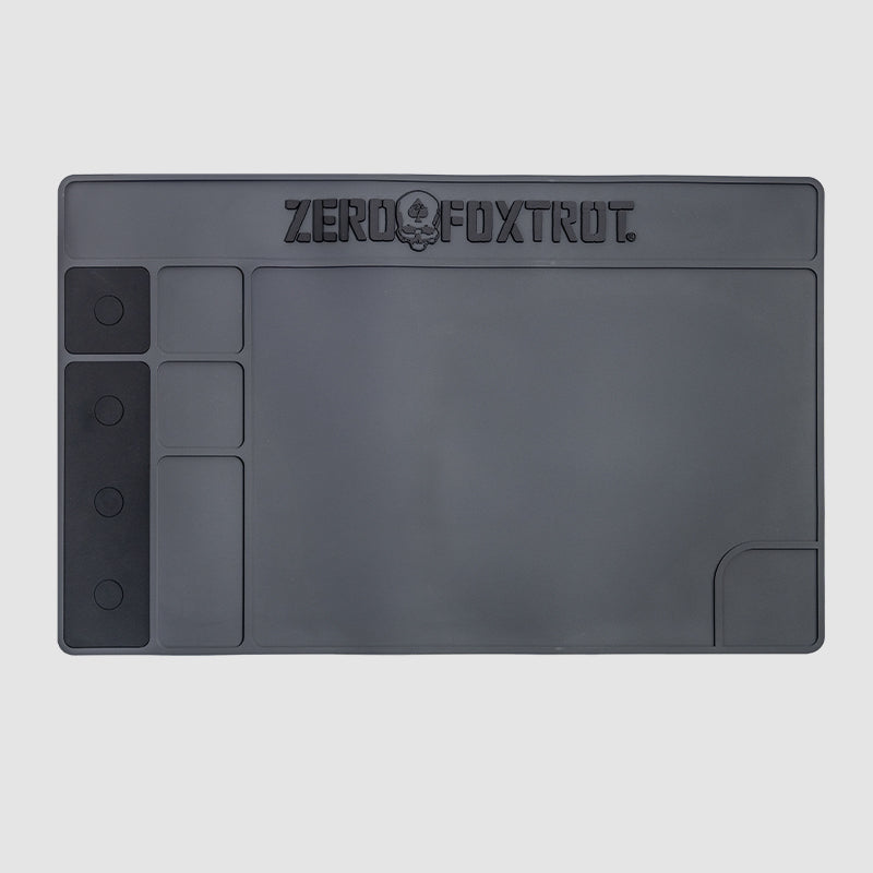ZF Gun Cleaning Mat in dark gray, featuring multiple compartments for organizing gun cleaning tools and a smooth surface for maintenance tasks.