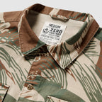 Close-up of a medium-sized CPO Shirt with a camouflage pattern in earth tones, featuring a buttoned collar and visible label inside the neckline.