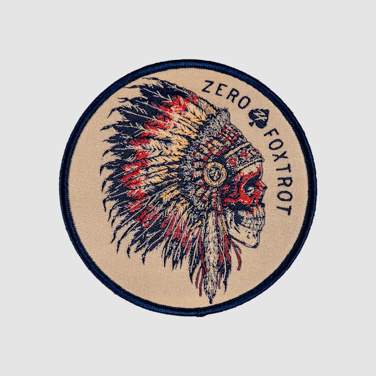Chief Patch circular embroidered patch featuring a detailed profile of a feathered chief in navy red and tan with Zero Fox Trot text