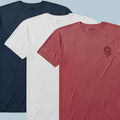 Three neatly laid out ZF Core Tee 250th Birthday 3-Pack shirts in navy blue, white, and red with a subtle printed design on the chest of the red shirt.