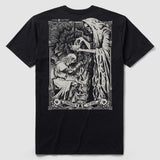 Black Crown of Life Tee featuring detailed white artwork of a cloaked skeletal figure crowning a kneeling knight with a sword entwined by a serpent, surrounded by skull motifs.
