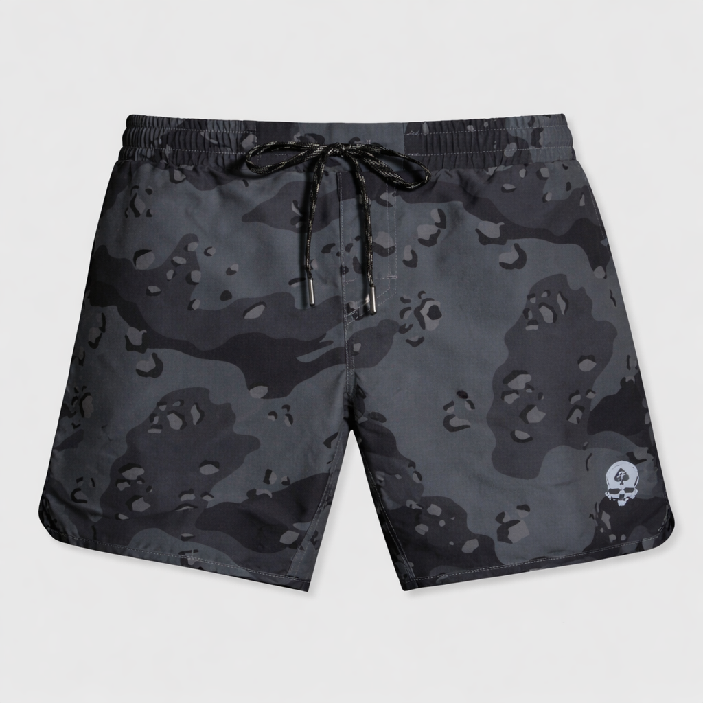 Zero Shorts - 7" Inseam in a dark camouflage pattern with an elastic waistband, black drawstring, and a small skull logo on the lower left leg.