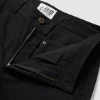 Foxhole 5 Pocket Pant in black, close-up of the waistband and open zip fly with button closure, belt loops, stitching, and interior construction
