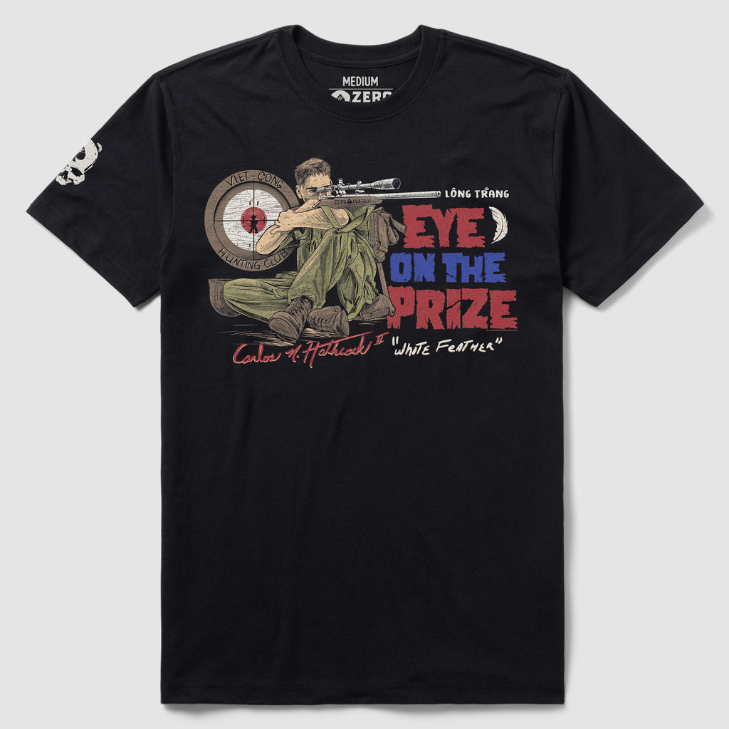 Black White Feather Tee featuring a graphic of a soldier aiming a sniper rifle at a target with the text "Eye on the Prize" in red and blue lettering