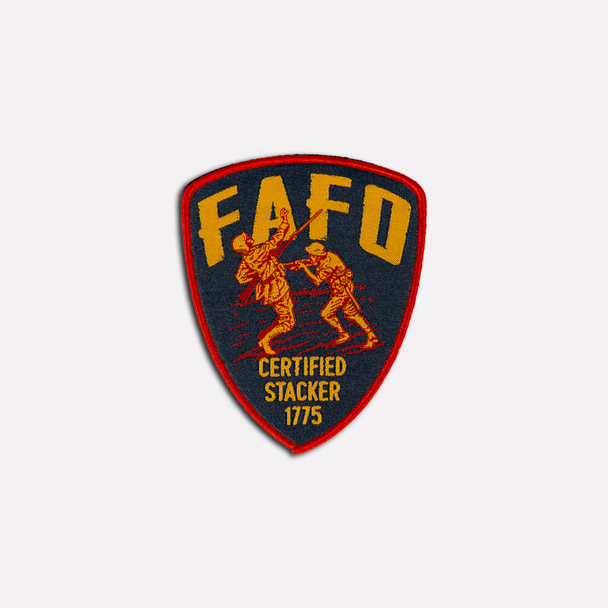FAFO Patch 2025, shield shaped embroidered patch with red border, gold lettering, two illustrated figures, and Certified Stacker 1775 text on a black background