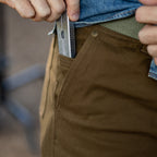 Foxhole 5 Pocket Pant in brown canvas with a ruler inserted into the front pocket, showing reinforced stitching and a secure pocket design