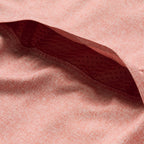 Close-up view of the textured fabric and inner mesh lining detail of the rust-colored F'n Soft Daily Shirt, highlighting its soft material and breathable construction.