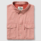 Folded rust-colored button-up shirt with two front flap pockets and a collar, labeled as F'n Soft Daily Shirt in size large.
