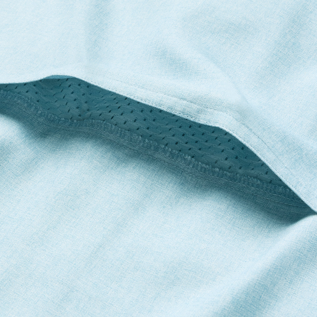 Close-up detail of light blue fabric with breathable mesh lining underneath, highlighting the ventilation feature of the F'n Soft Daily Shirt.
