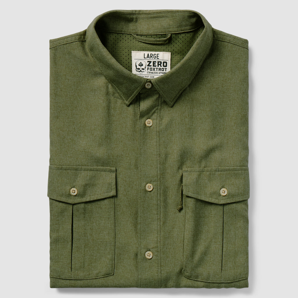 Folded dark olive green shirt with buttoned front and two flap pockets, labeled as F'n Soft Daily Shirt in a large size.