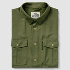 Folded dark olive green shirt with buttoned front and two flap pockets, labeled as F'n Soft Daily Shirt in a large size.