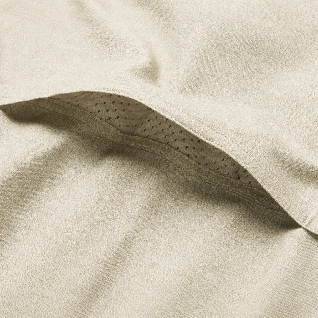 Close up of the soft cream fabric and curved perforated seam detail on the F'n Soft Daily Shirt