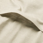 Close up of the soft cream fabric and curved perforated seam detail on the F'n Soft Daily Shirt