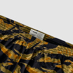 Close-up of camo-patterned elastic waistband with label on ZF Silkies - Camos shorts, featuring green, brown, and black shades in a tiger stripe design.