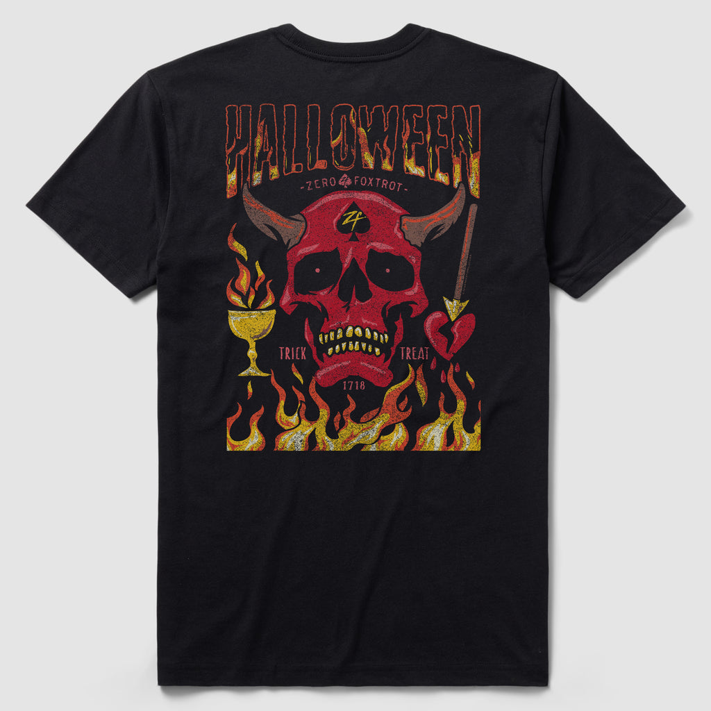 Back view of a black Halloween No Quarter Tee featuring a red skull with horns, flames, a chalice, an arrow-pierced heart, and decorative text reading "Halloween" and "Trick or Treat" in fiery colors.