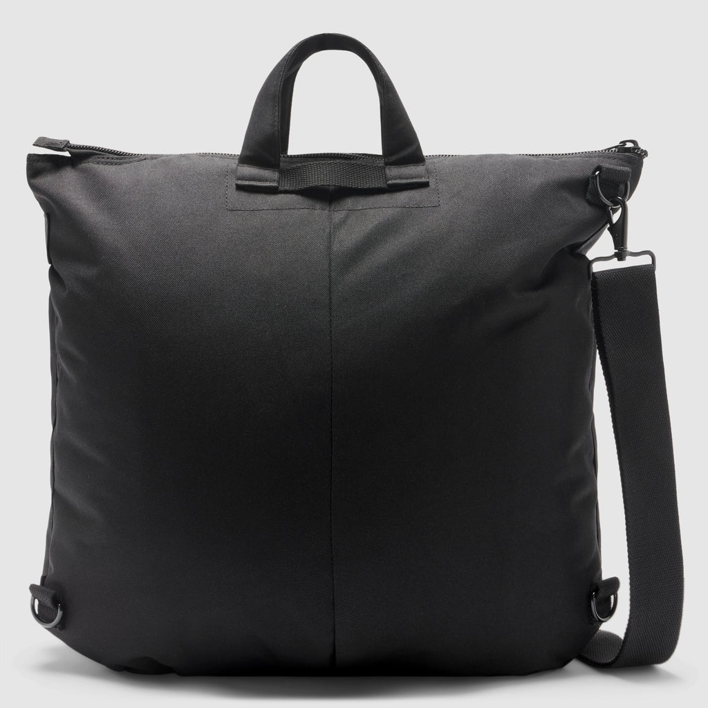 ZF Flyers Helmet Bag in black with dual carry handles, zippered top, side attachment rings, and a detachable adjustable shoulder strap against a plain background