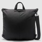ZF Flyers Helmet Bag in black with dual carry handles, zippered top, side attachment rings, and a detachable adjustable shoulder strap against a plain background