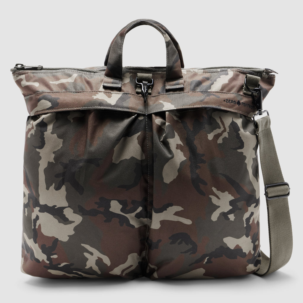 ZF Flyers Helmet Bag in camouflage with dual handles, zip top, front compartments, and adjustable shoulder strap shown against a light background