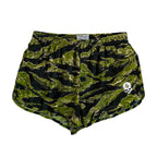 Green and black camouflage patterned shorts with a white skull logo on the left leg, elastic waistband, labeled as ZF Silkies - Camos.
