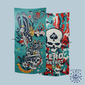 Two colorful Microfiber Beach Towels featuring bold skull designs, one with an eagle and patriotic elements, and the other with a camouflage pattern and a large skull emblem.