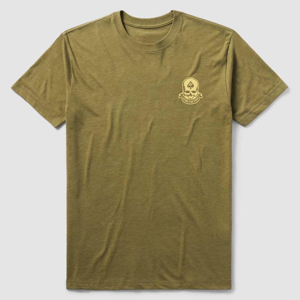 Mutually Assured Tee in olive green featuring a small skull and crossed bones graphic with the phrase "Mutually Assured" on the left chest, made of soft cotton fabric.