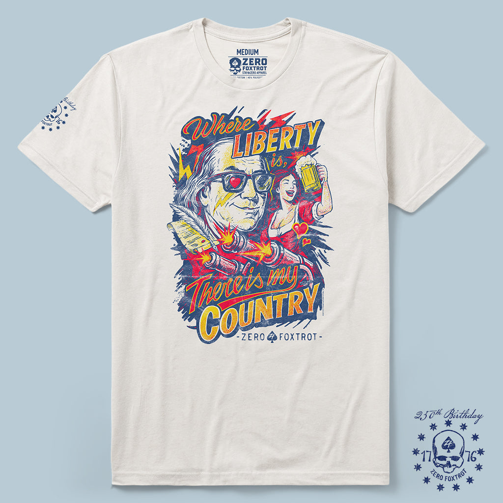 White My Country Tee featuring a colorful graphic of a man with sunglasses, a woman holding a beer, and text saying "Where liberty is, there’s my country," with additional design elements on the sleeve.