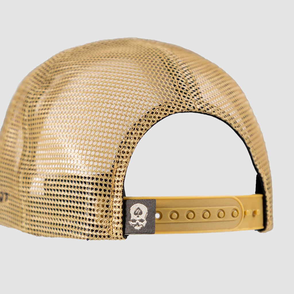 No Quarter Cap shown from the back in tan mesh with a yellow adjustable snapback closure and a small skull patch on the rear band