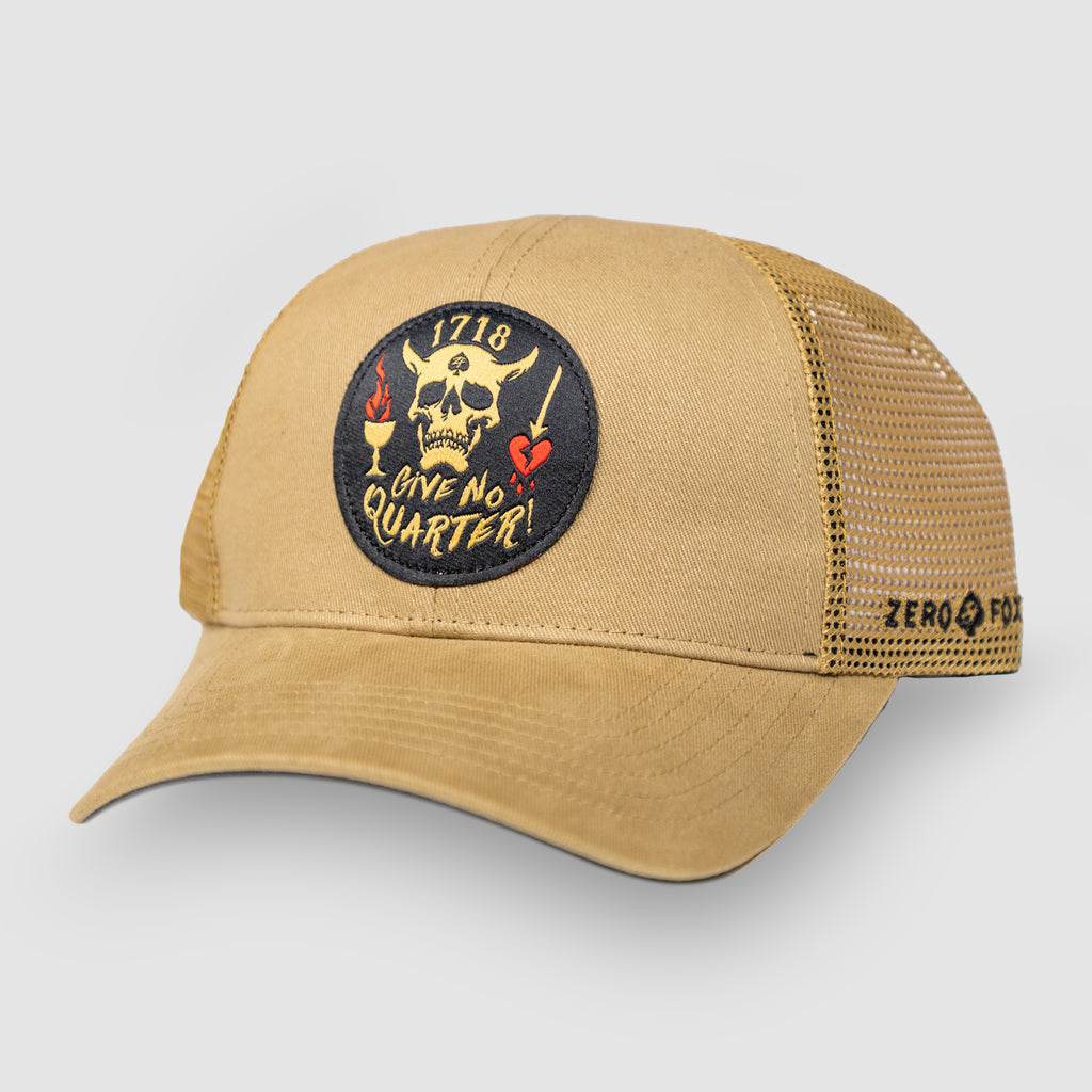 No Quarter Cap tan trucker hat with mesh back, curved brim, and embroidered skull, heart, and Live No Quarter patch on the front