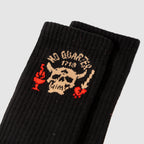 Zero Socks -No Quarter black ribbed socks featuring a cream skull graphic with red accents and a contrasting black pair layered behind it