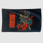 Namakubi Flag in black with vivid red and blue artwork of a Japanese warrior battling a red demon, alongside bold red lettering and illustrations