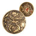 Namakubi Coin featuring two bronze engraved faces with Japanese warrior imagery, a dragon-like figure, stylized characters, and an ornate circular border