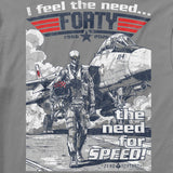 Graphic design on Feel the Need Tee featuring a military pilot in flight gear walking away from a fighter jet, with bold text "I feel the need... FORTY 1986-2026" and "the need for SPEED!" in vintage style.