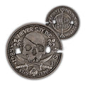 Never Say Die Coin with a distressed silver finish, skull artwork, fleur de lis details, and an ornate reverse side shown on a white background