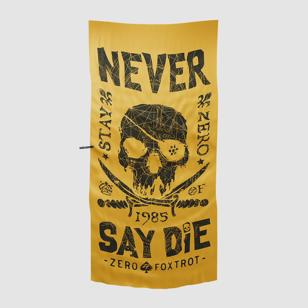 Yellow Microfiber Beach Towels featuring a black graphic design of a skull with crossed swords and bold text reading "Never Say Die" and "Stay Zero Foxtrot 1985.