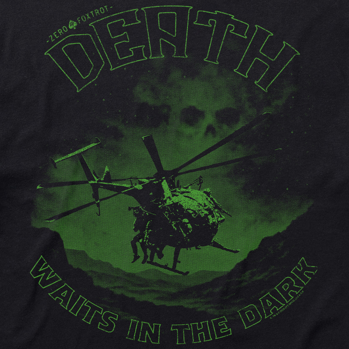 Close-up of the Night Stalkers Tee featuring a green graphic of a helicopter with soldiers and the phrase "Death waits in the dark" against a dark background.