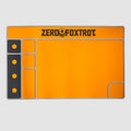 Bright orange ZF Gun Cleaning Mat with black and gray accents, featuring compartments for tools and parts, and the Zero Foxtrot logo at the top center.