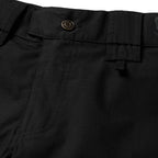 Tac Pants close up showing black fabric waistband button belt loops utility pockets and detailed stitching