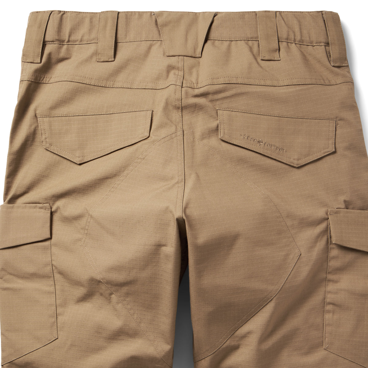 Tac Pants in tan with belt loops reinforced stitching rear pockets and large side cargo pockets shown in a close up product view