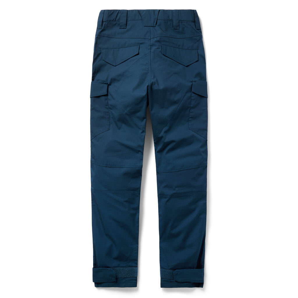 Tac Pants in navy blue with multiple utility pockets, belt loops, articulated knees, and adjustable ankle cuffs, shown from the back on a white background