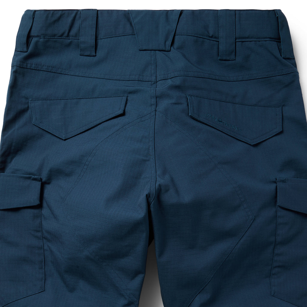Tac Pants in dark navy with belt loops, flap pockets, cargo pockets, reinforced stitching, and a practical utility design shown in close up detail