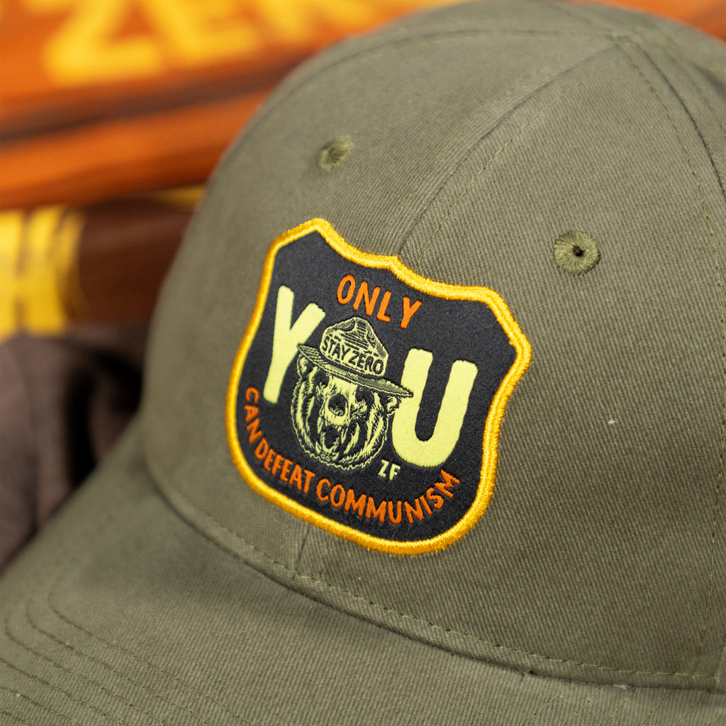 Only You Cap in olive green with a black and yellow embroidered Only You patch on the front and a curved brim close up