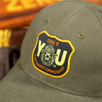 Only You Cap in olive green with a black and yellow embroidered Only You patch on the front and a curved brim close up